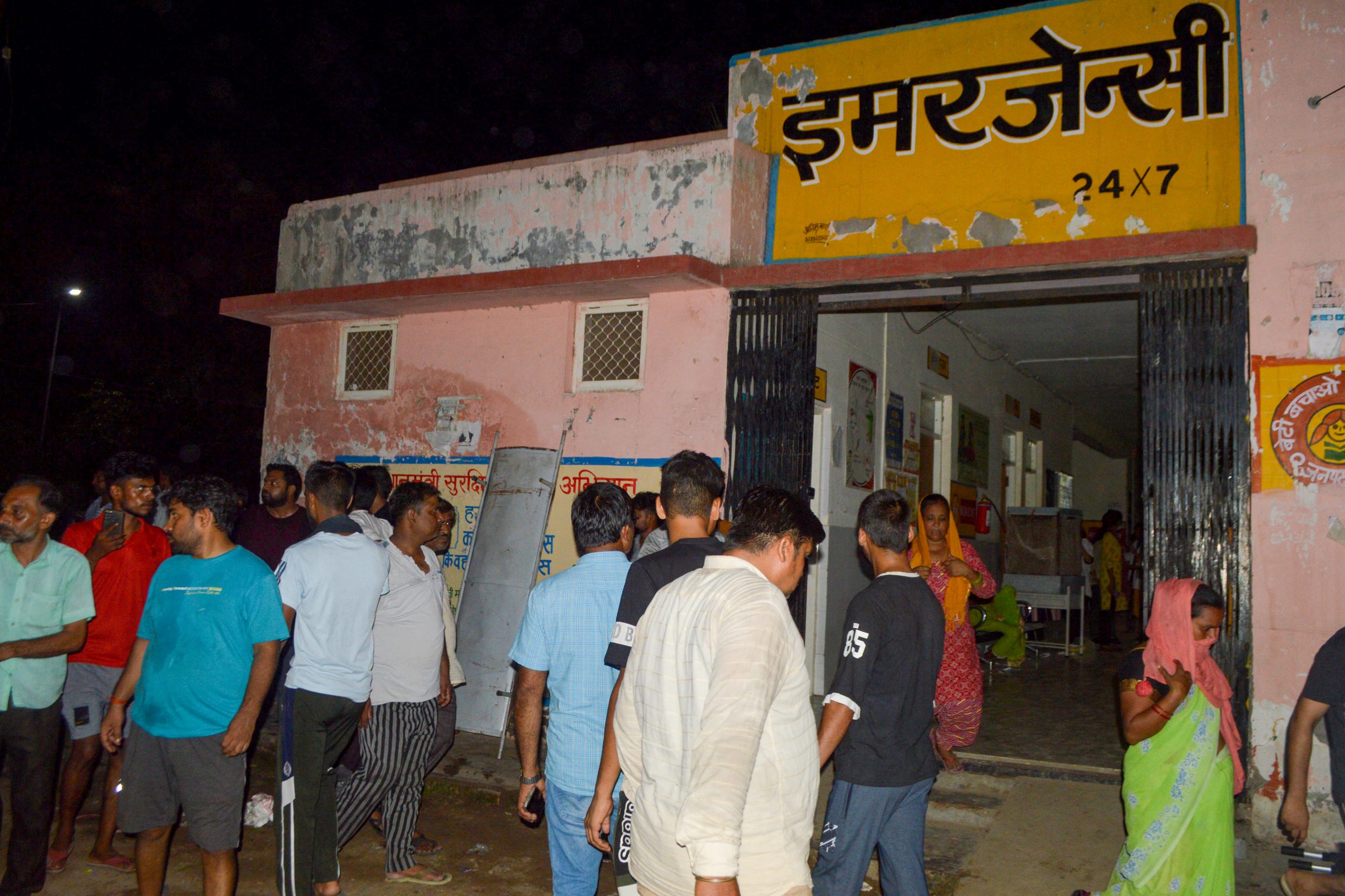 Mourners gather as the deceased who died in a melee during a sermon, are brought to a hospital in Hathras in India's Uttar Pradesh state on July 2, 2024. Nearly 100 people were crushed to death in a stampede at a Hindu religious gathering in northern India on July 2, with many others injured, a senior government official said. (Photo by Pawan SHARMA / AFP)