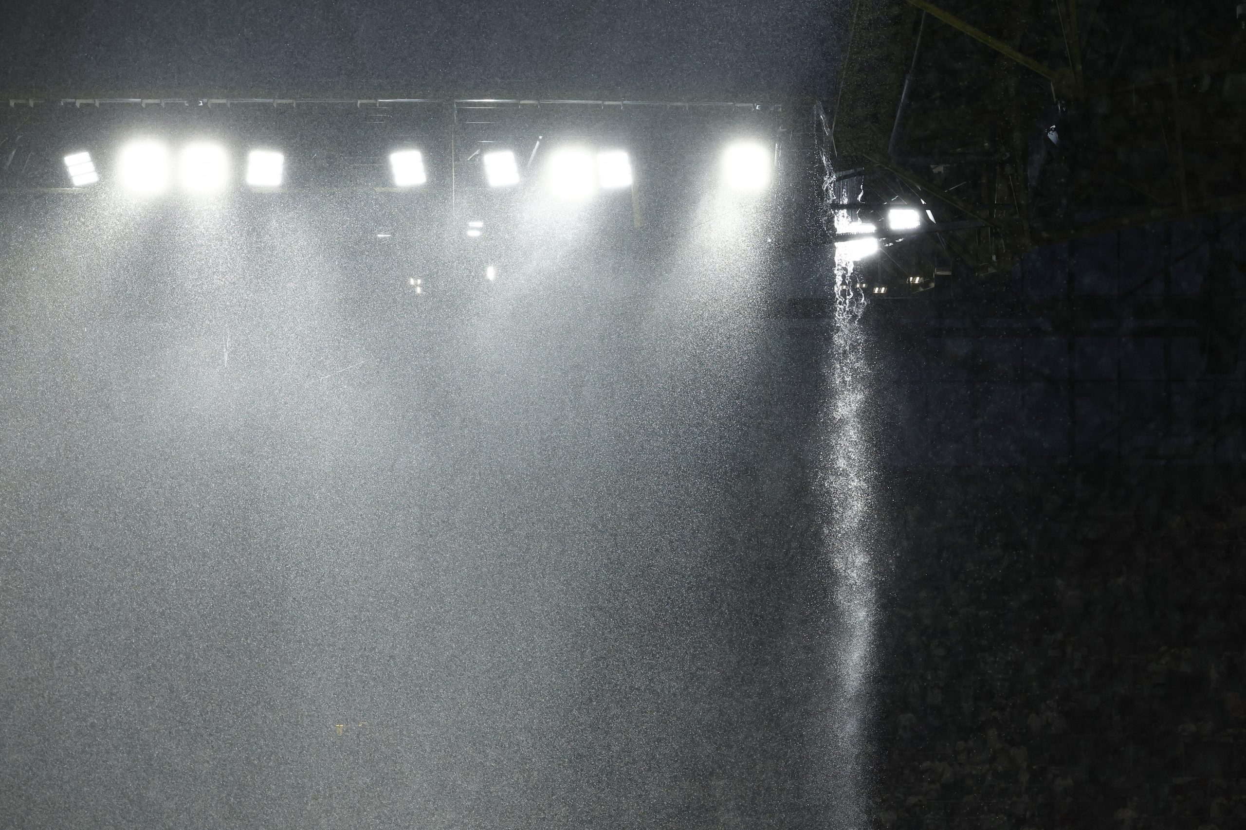 Heavy rain pours over the BVB Stadion during the UEFA Euro 2024 round of 16 football match between Germany and Denmark, in Dortmund on June 29, 2024. (Photo by KENZO TRIBOUILLARD / AFP)